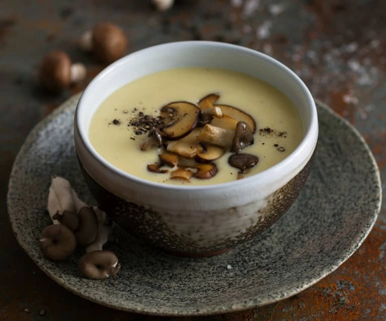 Mushrooms Soup Accompanied By A Drizzle Of Olive Oil And Mushrooms Powder (V)