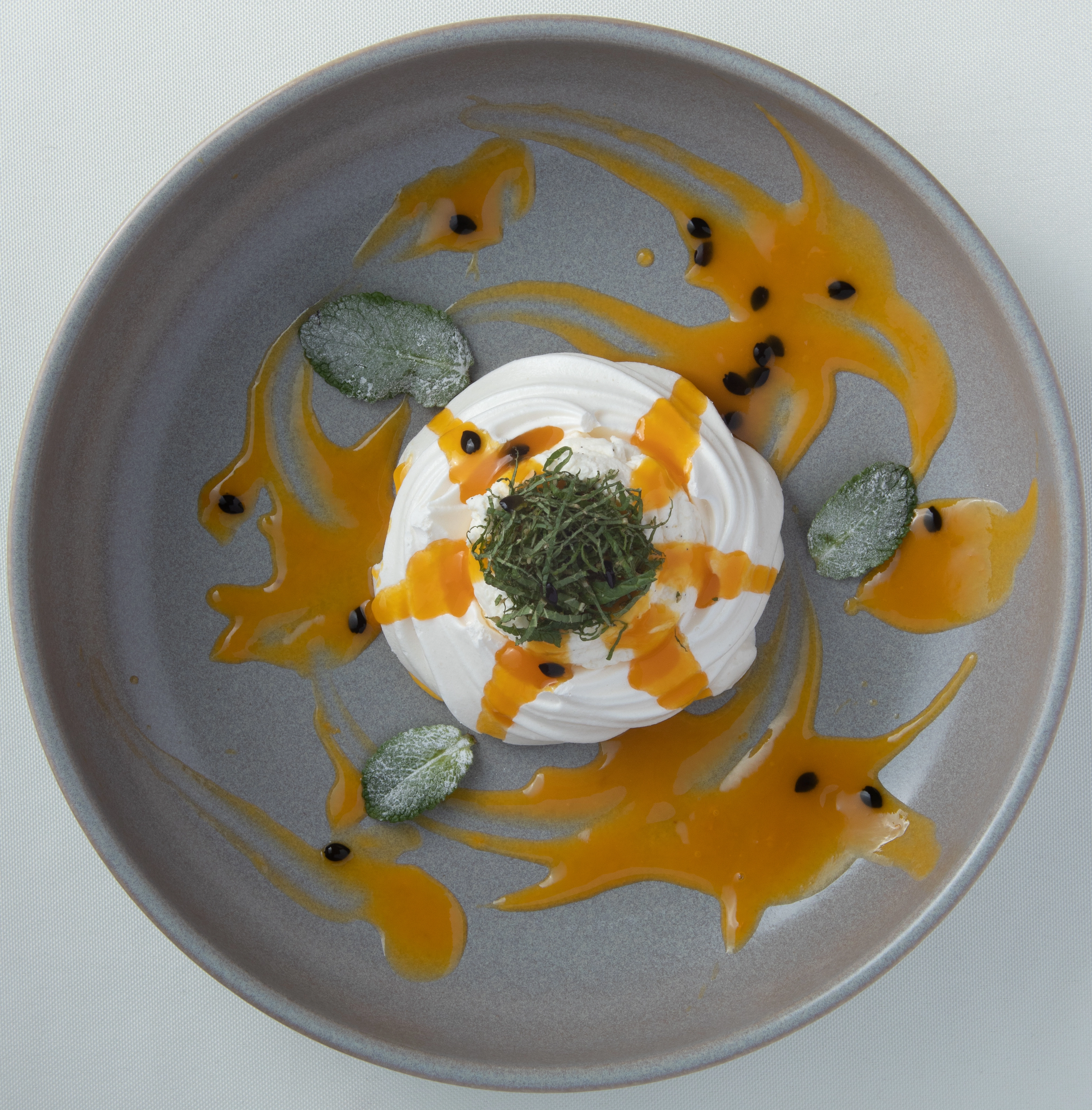 Mango And Passionfruit Curd Pavlovas With Pistachio Black Cardamom Praline (V)