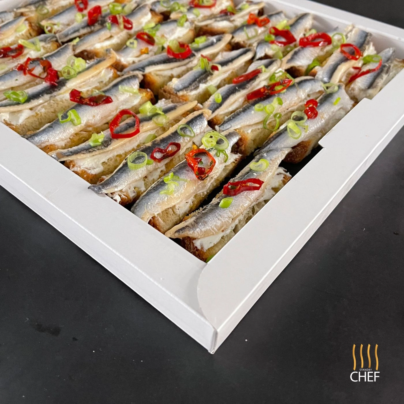 Finger Bruschetta With White Anchovies On Lemon Mascarpone