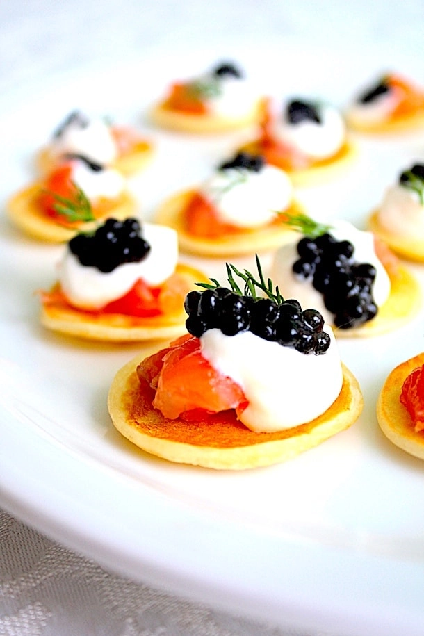 Smoked Salmon On Blini Served With Whipped Avocado And Finish With Caviar