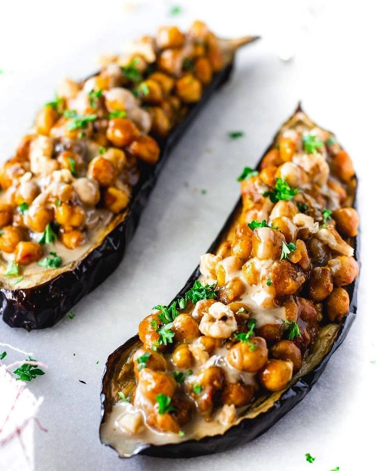 Stuffed Aubergine, Chickpea Stew, Labneh, Pomegranate & Roasted Almond Flakes (V)