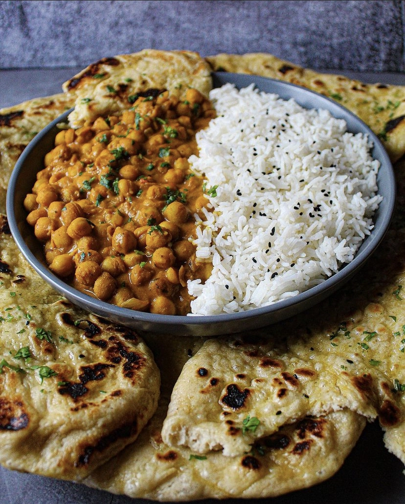 Chickpea Tikka Masala Served With Coconut Infused Basmati Rice And Garlic Butter Naan