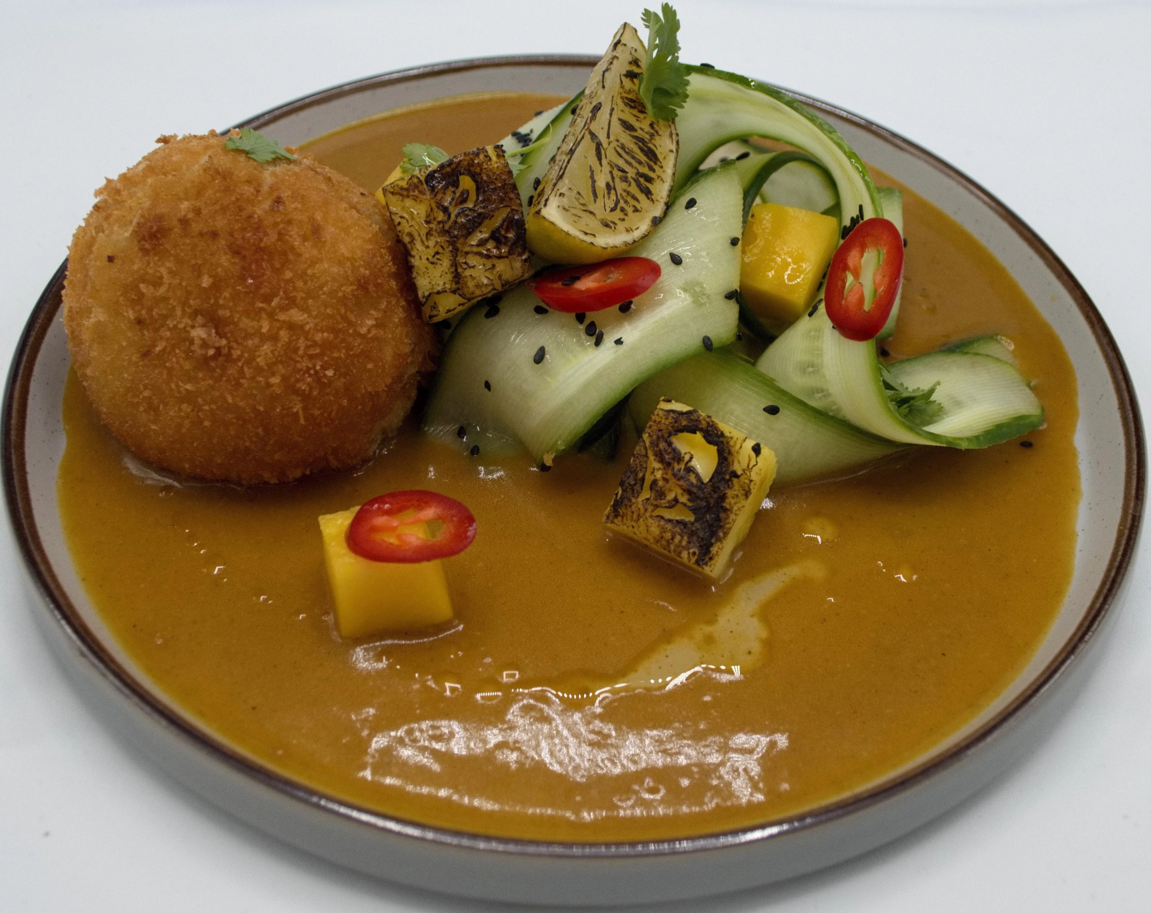 Confit Duck Croquette, Japanese Curry Sauce, Dressed Cucumber Ribbons, Brule'd Alphonso Mango