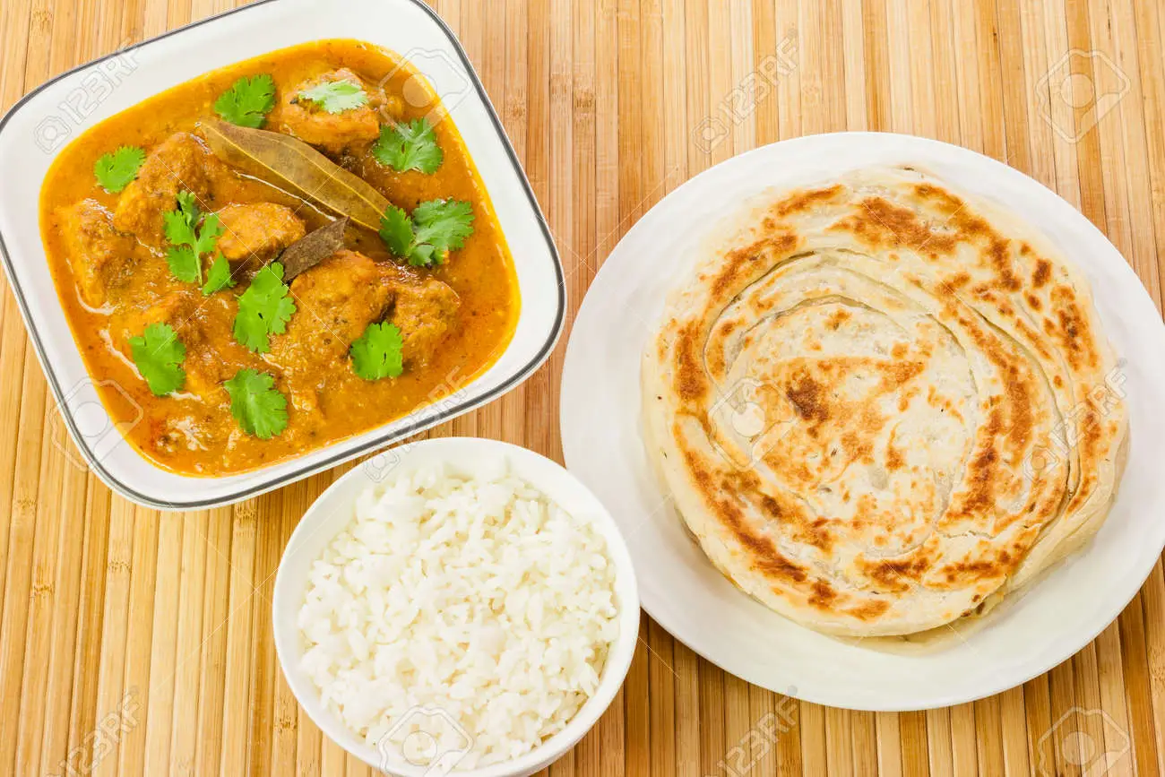 Delicious Vegetable Curry Served With Some Fluffy Turmeric Rice And Fresh Homemade Chapati