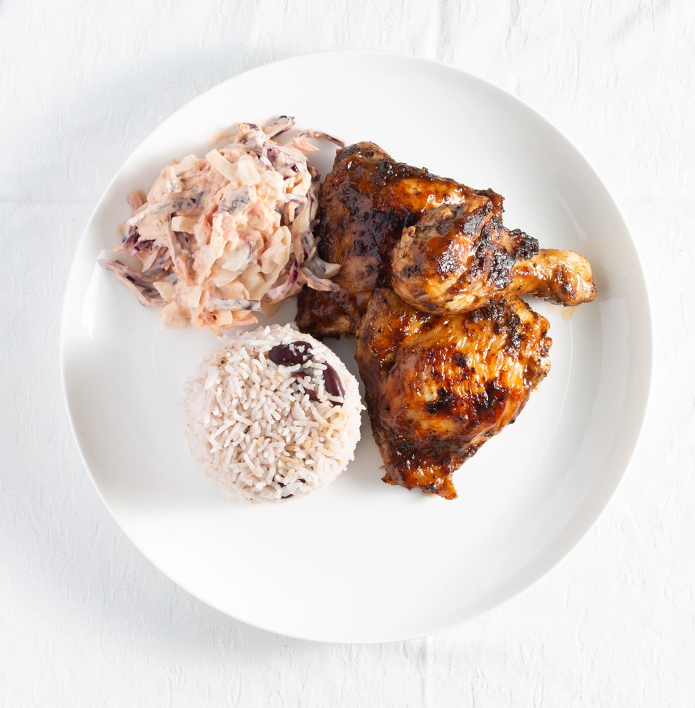 Taste Of Jamaica Jerk Chicken Served With Peas Rice And Boiled Plantain