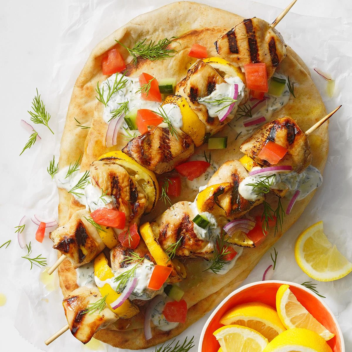 Chicken, Pork Or Halloumi(V) Souvlaki Wrapped In A Corn Flatbread, Filled With Tomato, Onion & Tzatziki, Optional Special Tomato Sauce