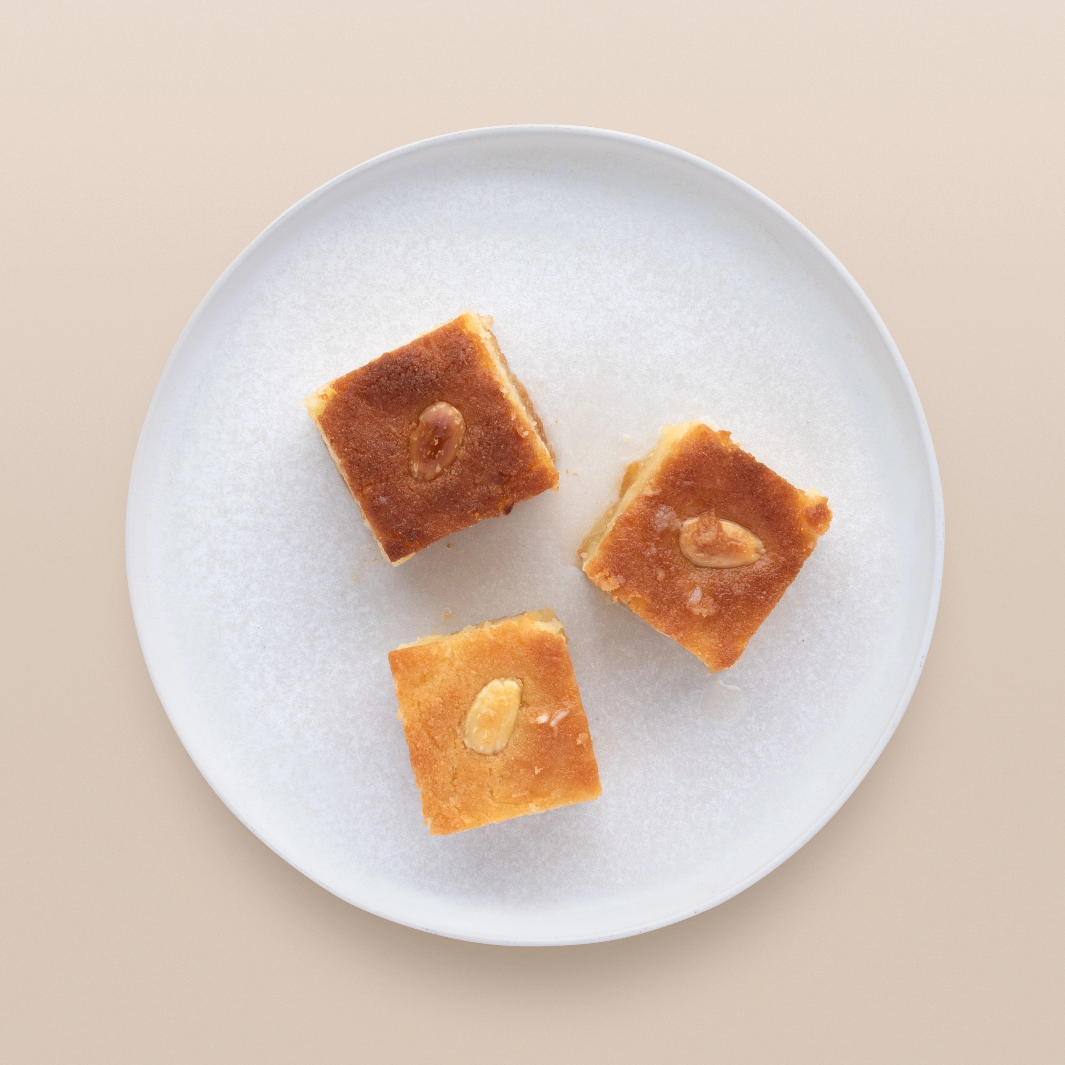 Basbousa With Blanched Roasted Almonds And A Rose Water Syrup