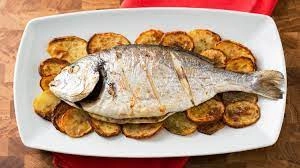 Baked Or Grilled Sea Bream Fillet Accompanied By A Lemon Dressing