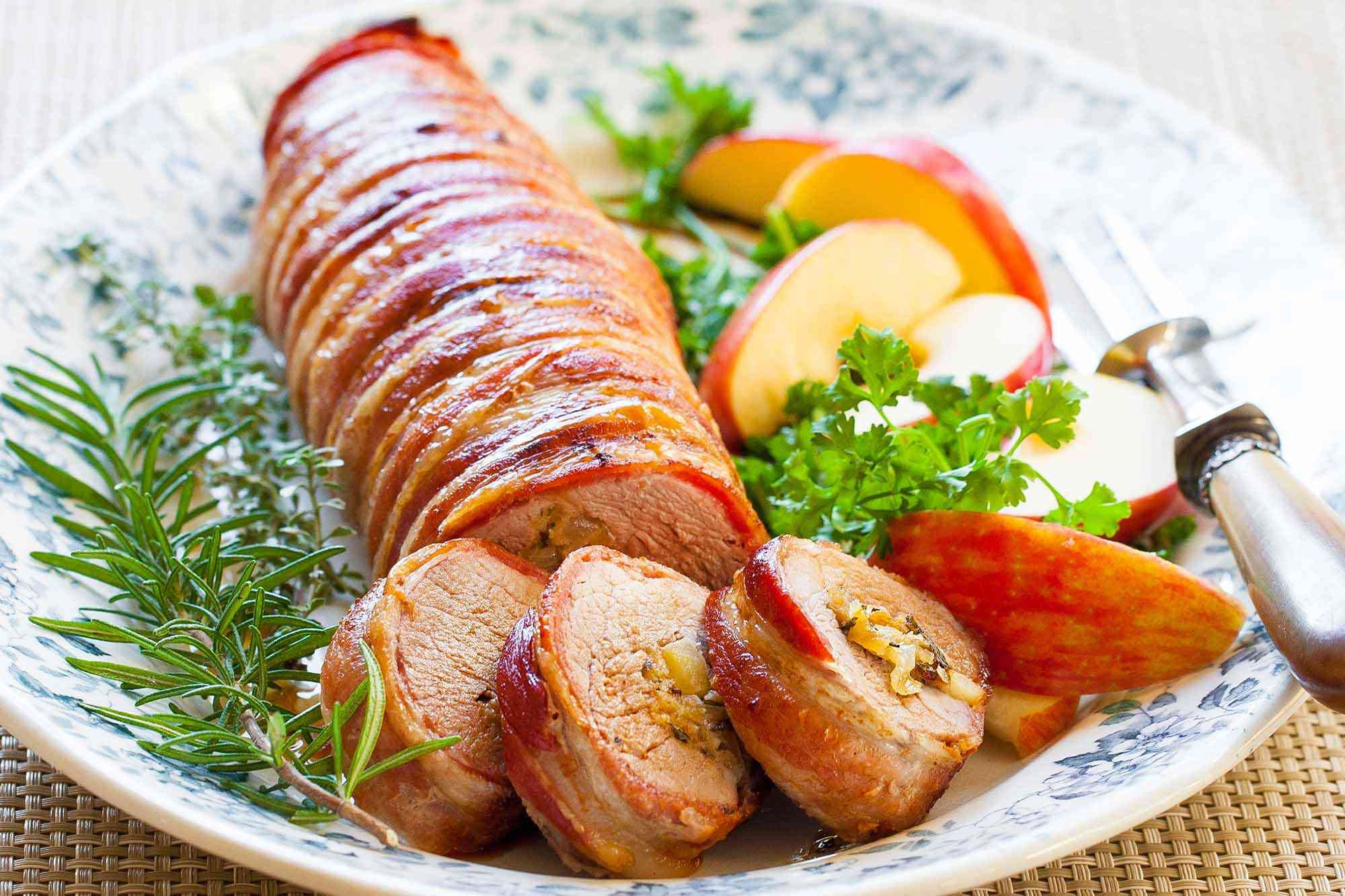 Bacon Wrapped Pork Tenderloin With Bourbon Sauce Wilted Garlic Spinach And Carrots-Swede Mush