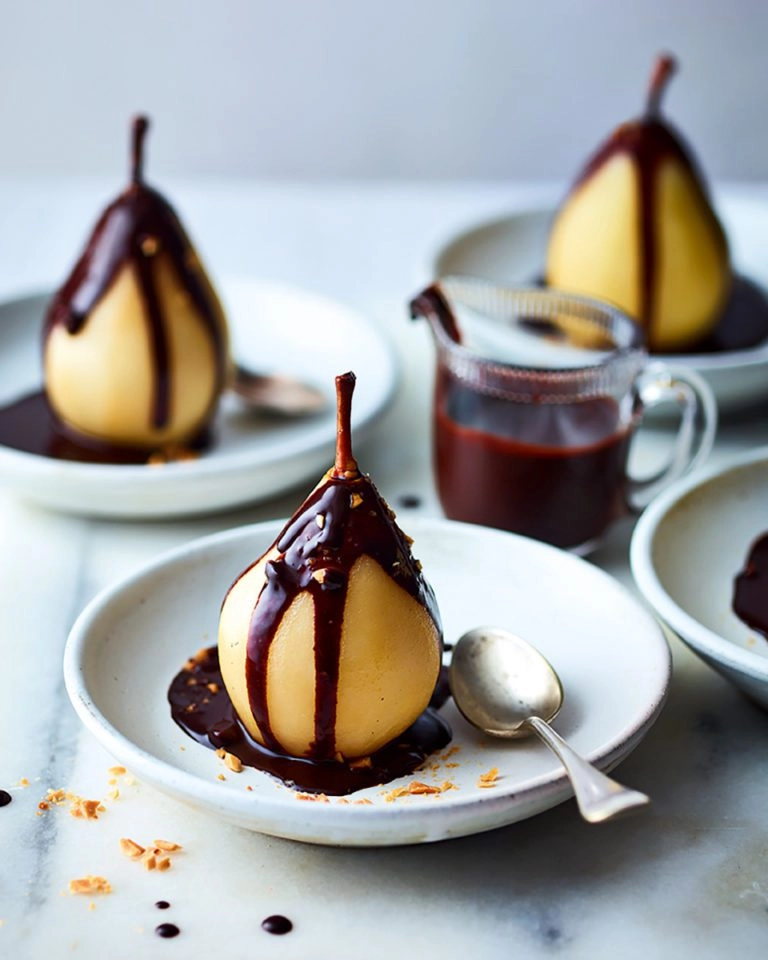 Whisky Poached Pears Coated In Dark Chocolate Salted Caramel Sauce, And Amaretti Crumb