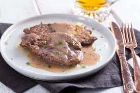 Beef Escalopes In Beer (Beef Escalopes Floured And Cooked In A Pan With Beer)