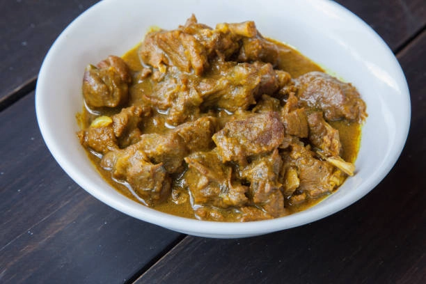 Goat Curry With Rice And Peas And Fried Or Steamed Sweet Plantain