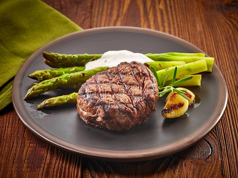 Beefsteak With Peppercorn Sauce And New Potatoes With Asparagus
