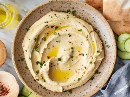 Mezze Selection Of Hummus, Taramosalata, Tzatziki & A Surprise Dip With Warm Pitta Bread (Ve)