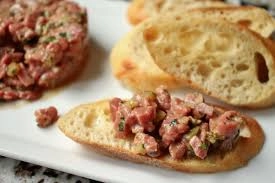 Beef Tartar Served On Melba Toast
