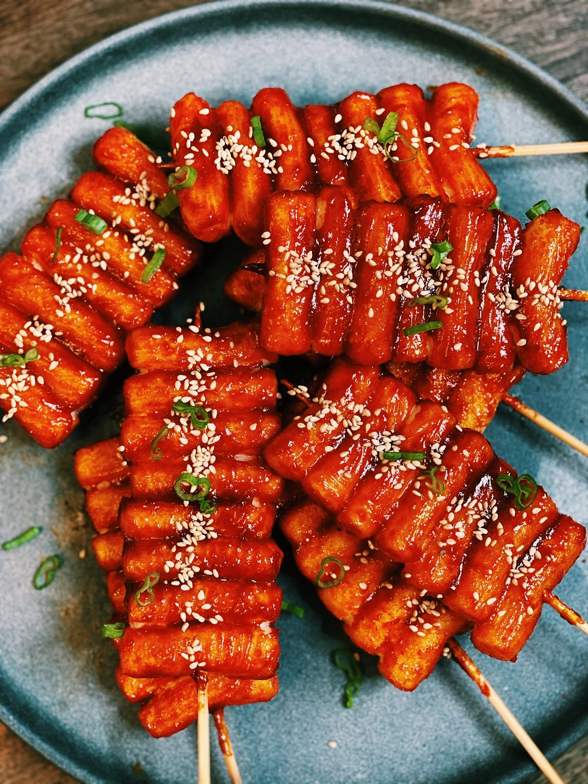 Skewered And Fried Tteok (Rice Cakes) Brushed With Spicy Gochujang-Based Sauce