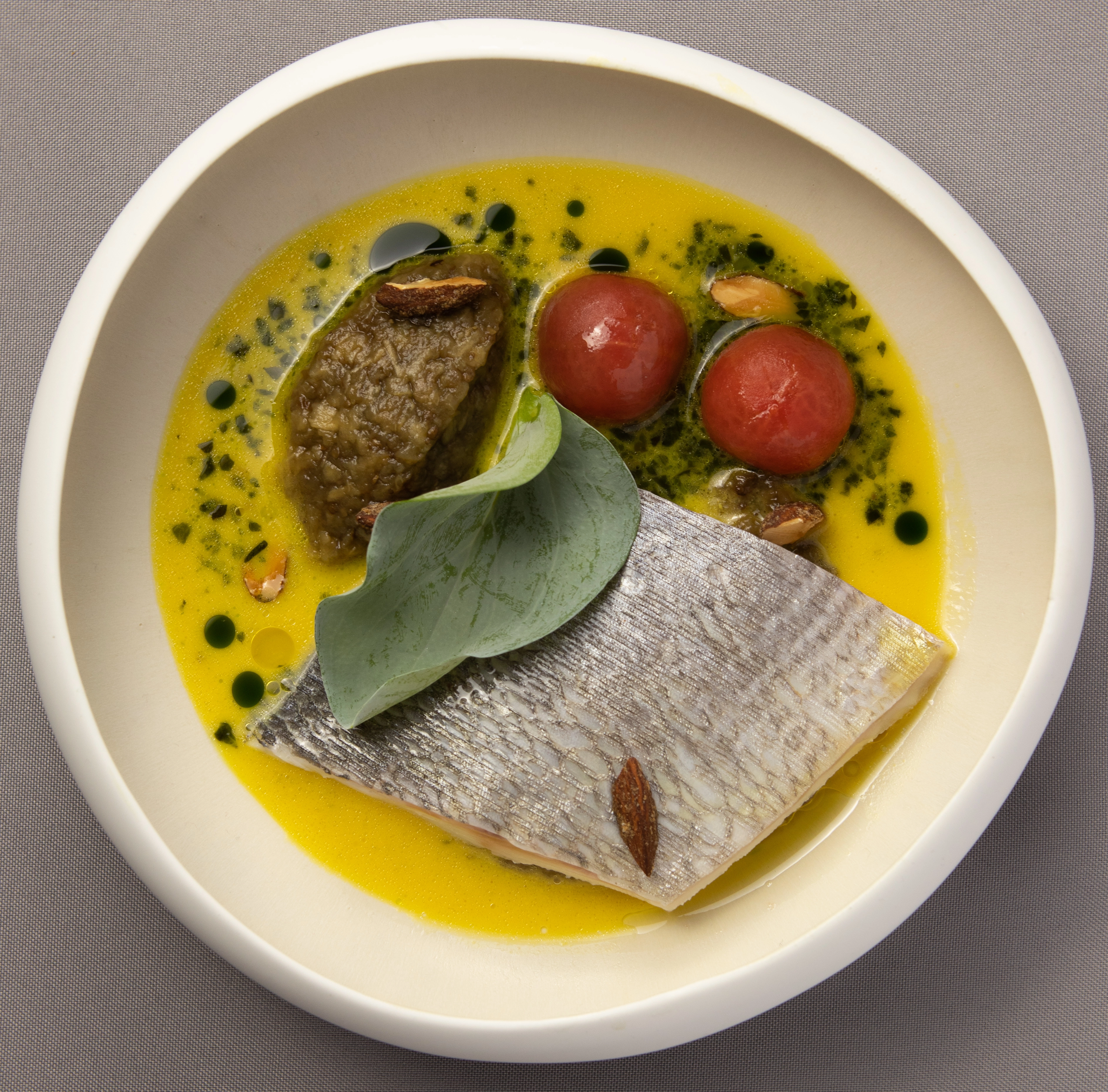 Poached Seabream In Saffron And Pistou Broth, Aubergine Caviar And Smoked Almonds