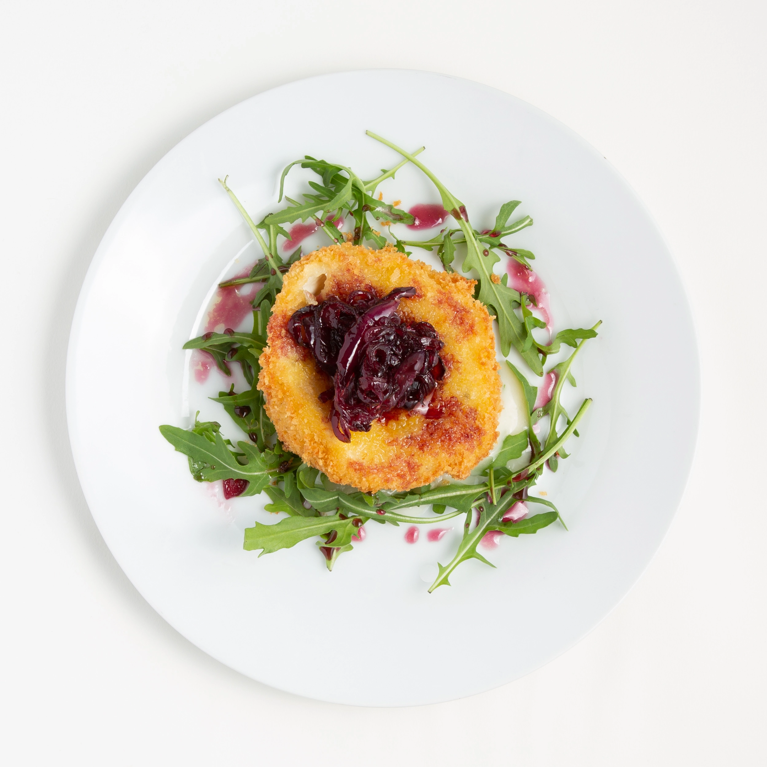 Fried Goat Cheese With A Bed Of Rocket Leaf And Red Onion Marmalade
