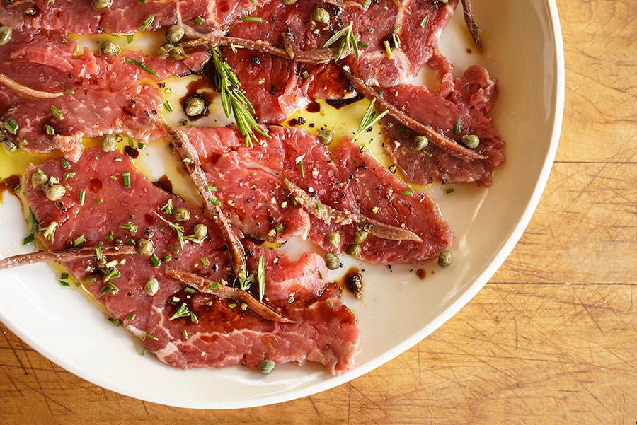 Herb-Marinated Beef Carpaccio With Pickled Artichokes & Parmesan