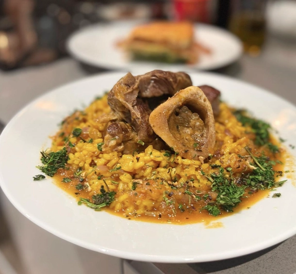 Ossombucco Milanese Served With Risotto Milanese