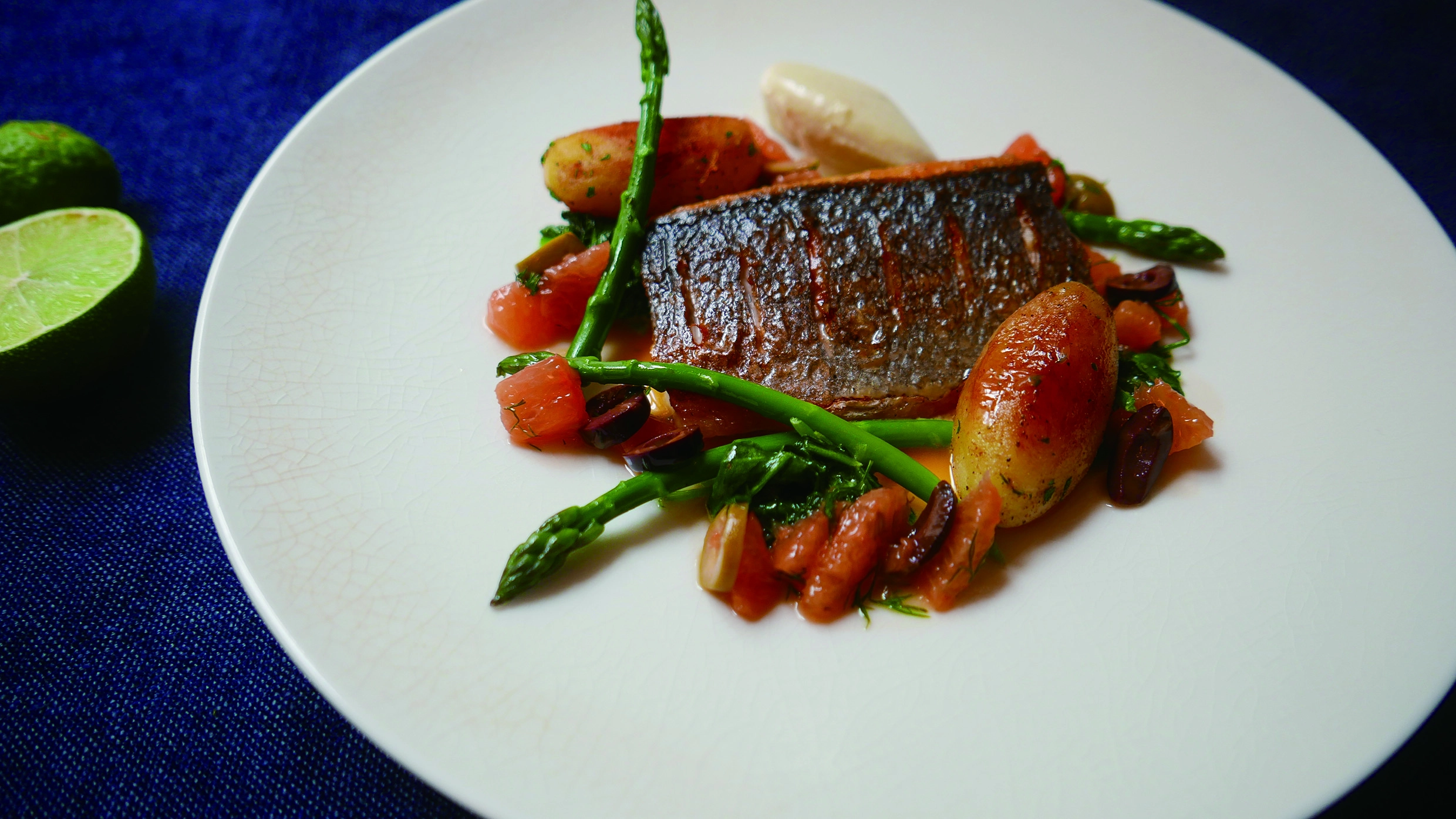 Pan Fried Sea Bass, Cauliflower Puree, Asparagus With A Pink Grapefruit & Olive Beurre Blanc