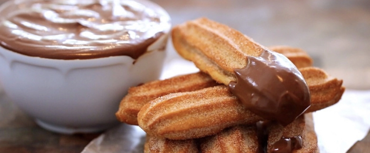 Churros Served With Warm Chocolate Sauce