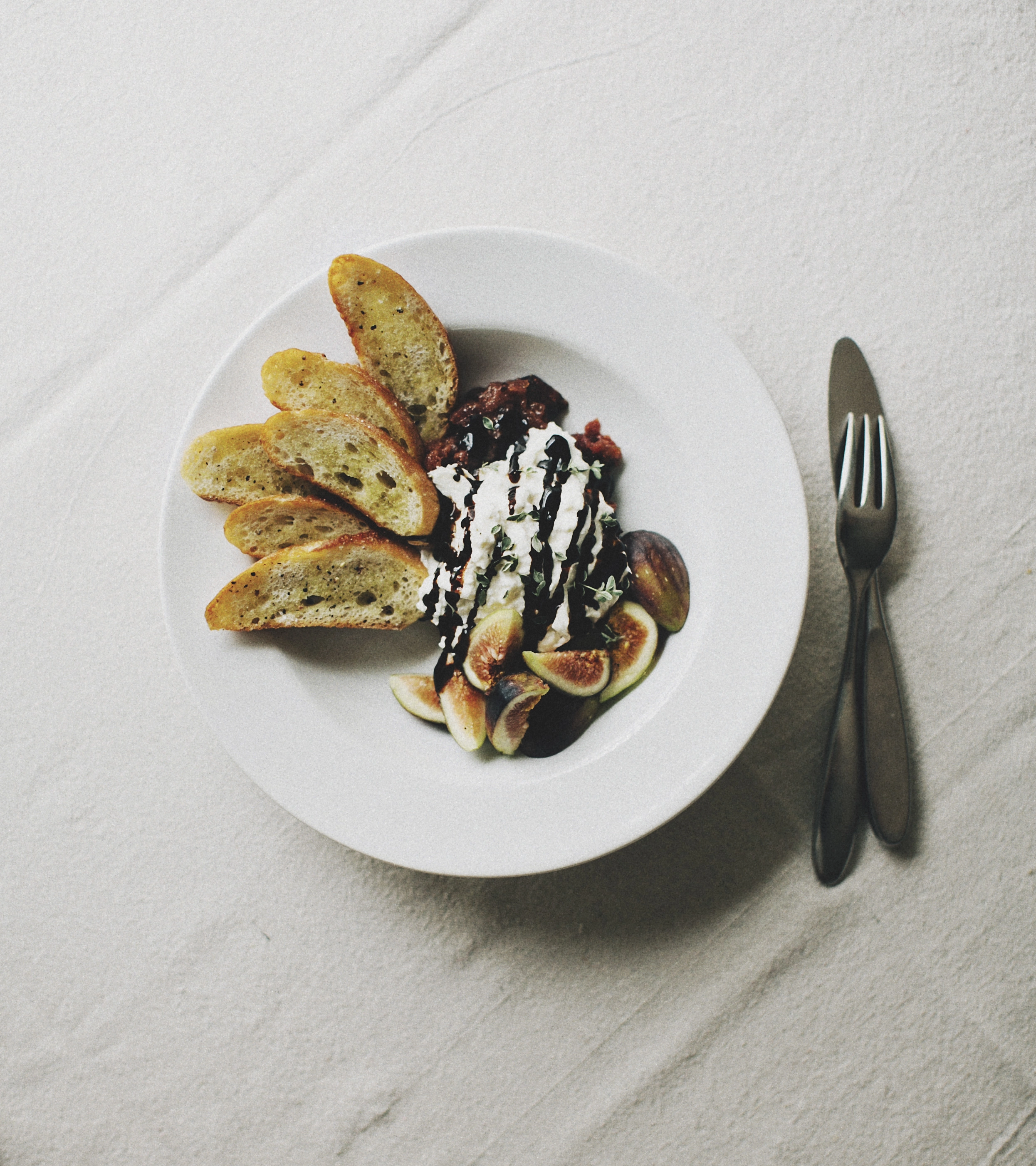 Burratta And Fig Crostinis With Salsa Verde Dressing