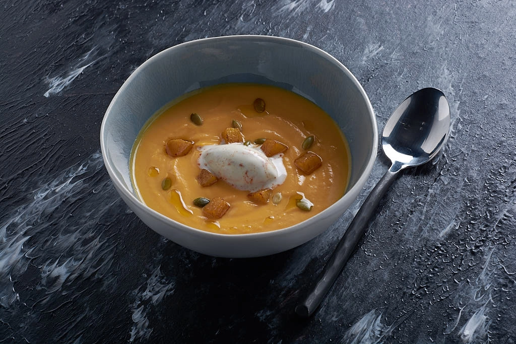 Butternut Velouté, Pumpkin Seeds And A Smokey Bacon Crème Fraîche (V)