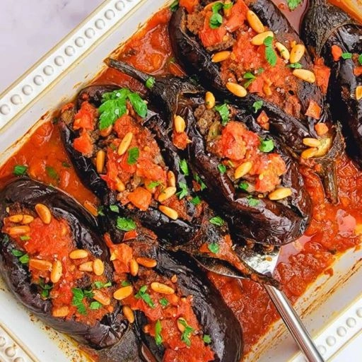Sheikh El Mehshi. Mini Aubergines Stuffed With Lamb, Oven Baked In Tomato Sauce, Toasted Pine Nuts 