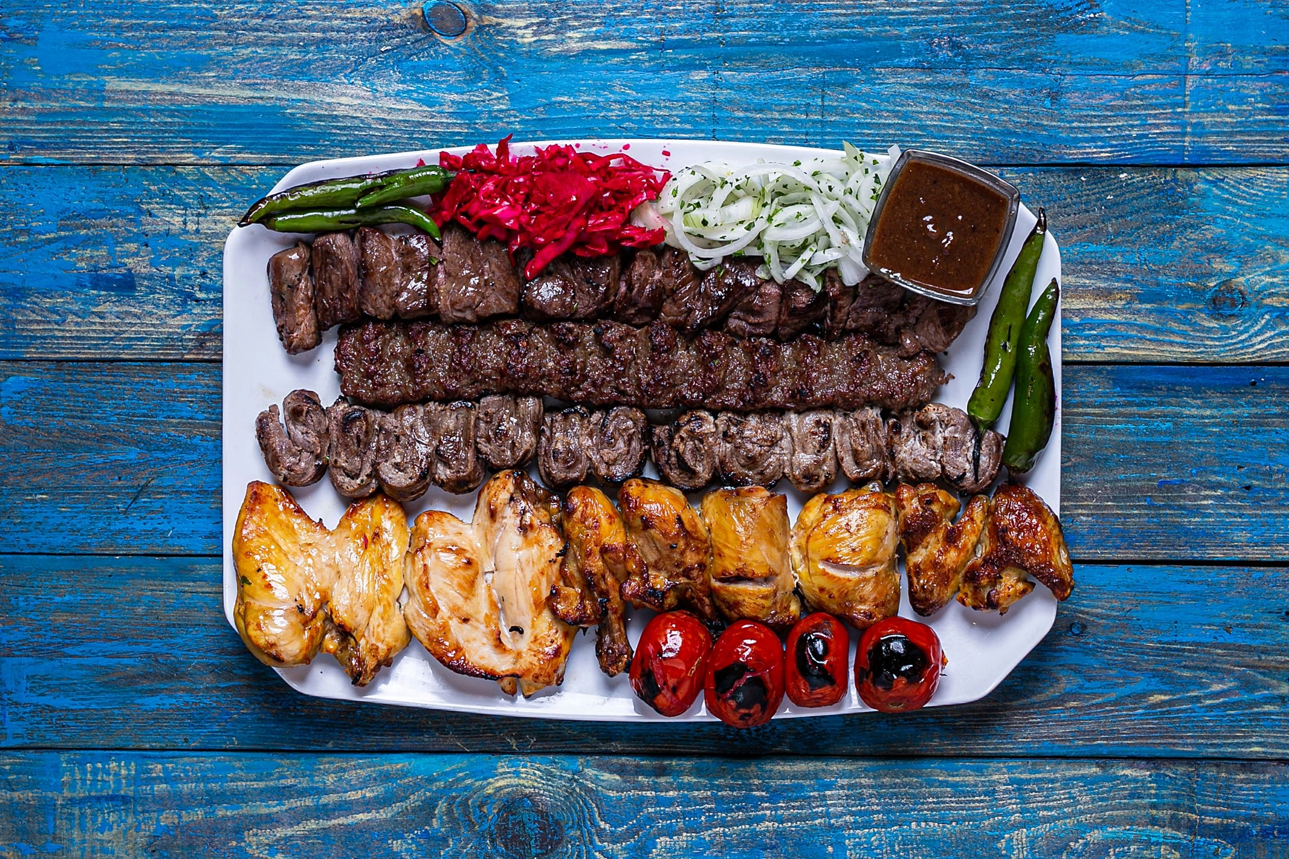 Mixed Grill Plater. Skewers Of Chicken Breast, Mince Lamb Kofta And Lamb Cutlets, Grilled Tomato, Onion And Chilli Peppers. 