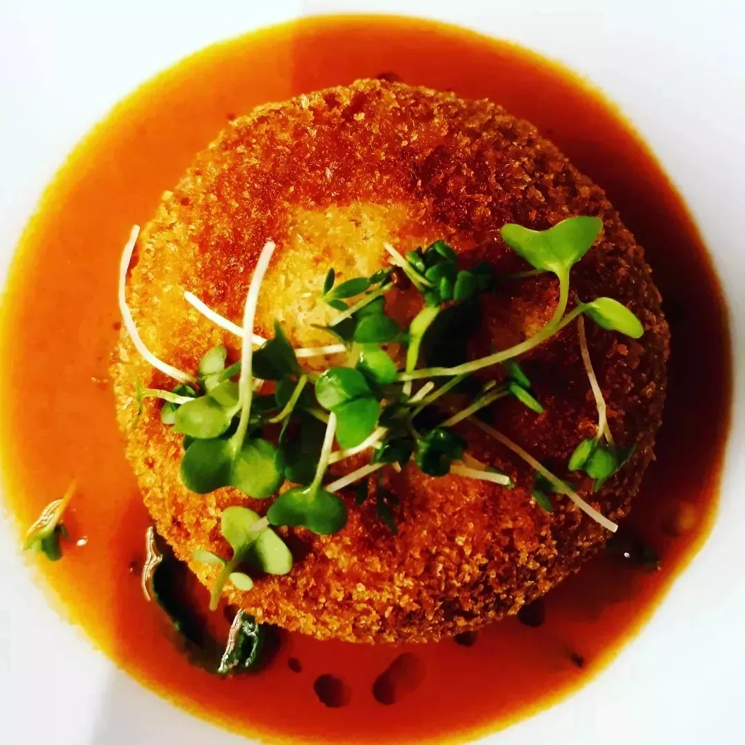 Smoked Salmon And Brixham Crab Croquet, Lobster Bisque Sauce, And Wilted Spinach