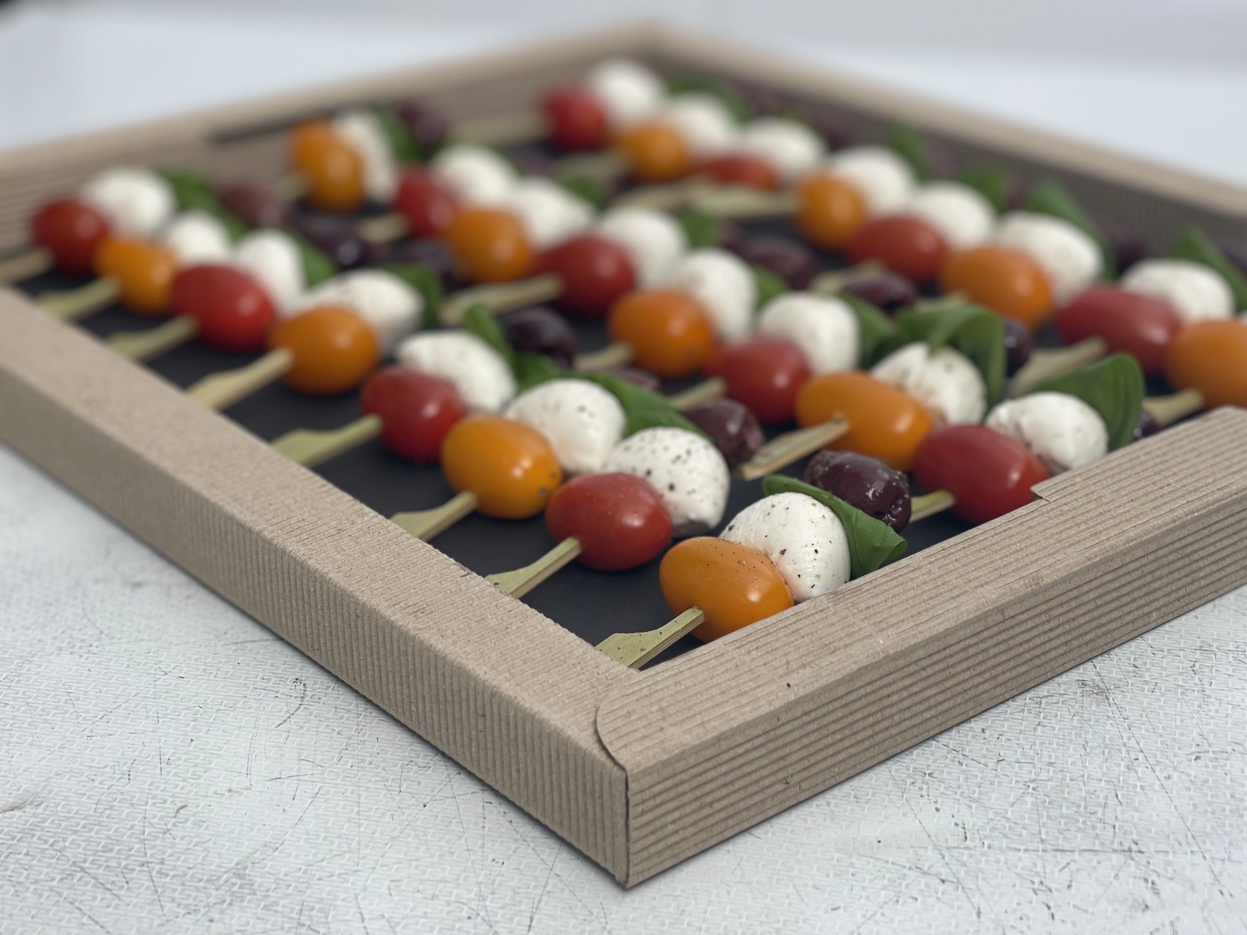 Cherry Tomato, Black Olives And Mozzarella Skewers