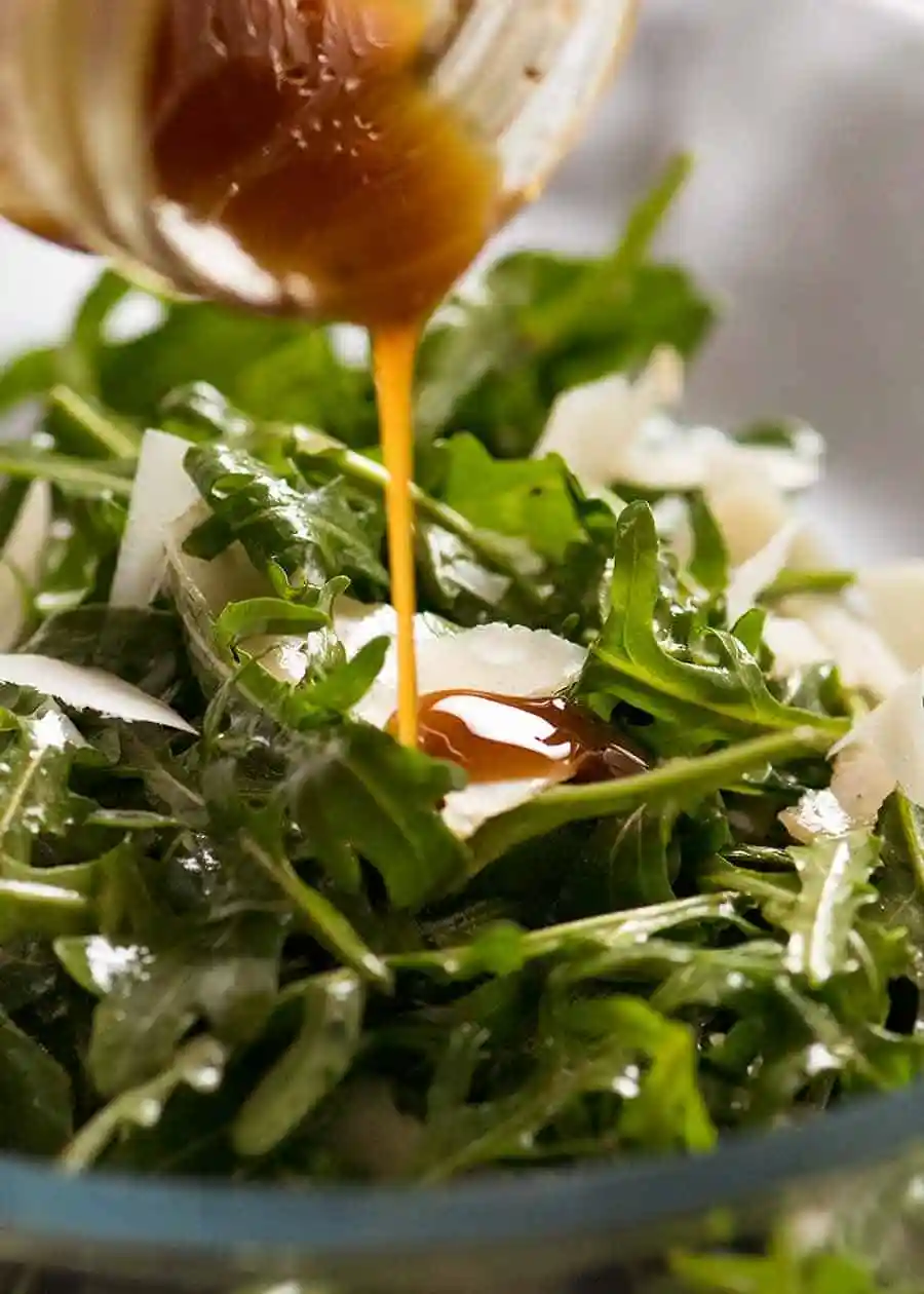 Rocket Salad With Parmesan And Olive Shavings With Balsamic Glaze
