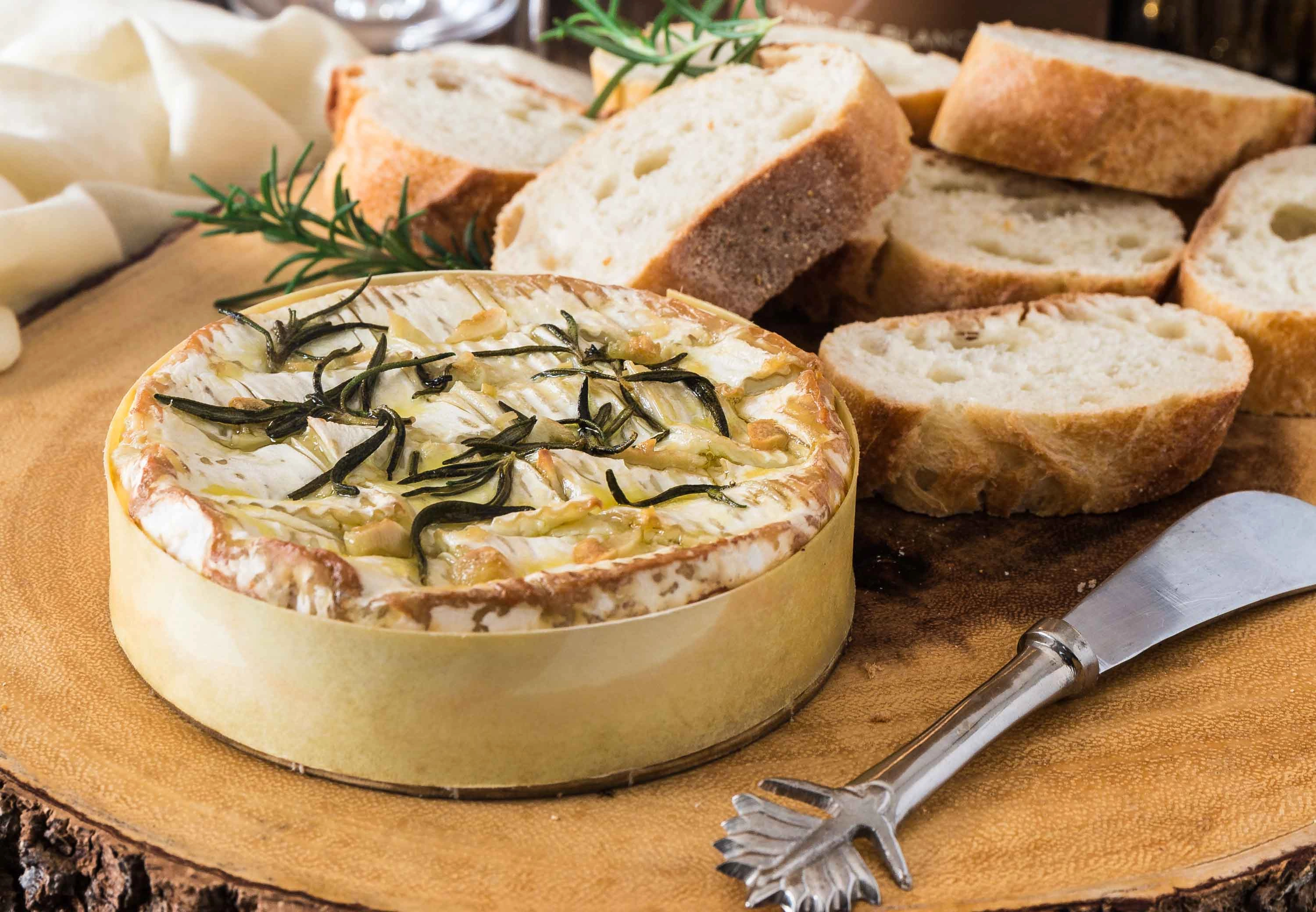Herb Infused Camembert Served With Homemade Olives Bread.
