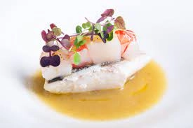 Crisp Pan Seared Fillet Of Sea Bass /New Potatoes Ballotine/French Beans /White Wine Glaze Sauce