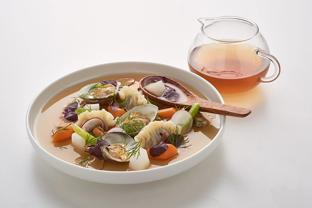 Chinese Style Dumplings With A Pork And Cockle Broth Infused With Ginger 