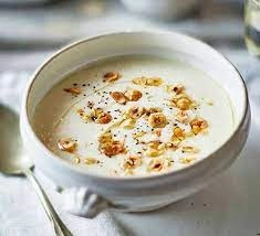 Celeriac And Hazelnut Soup Accompanied By A Drizzle Of Truffle Oil And Chopped Hazelnut (V)