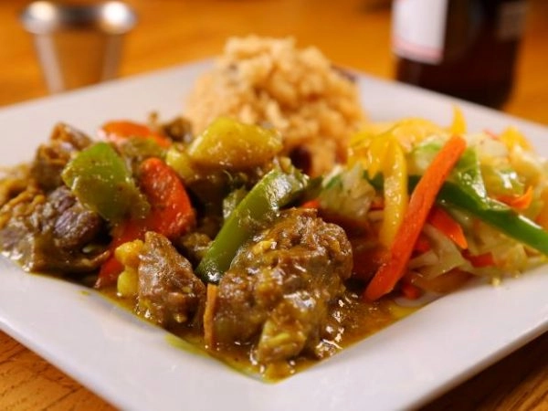 Slow Cooked Tender Curry Goat & Rice N Peas