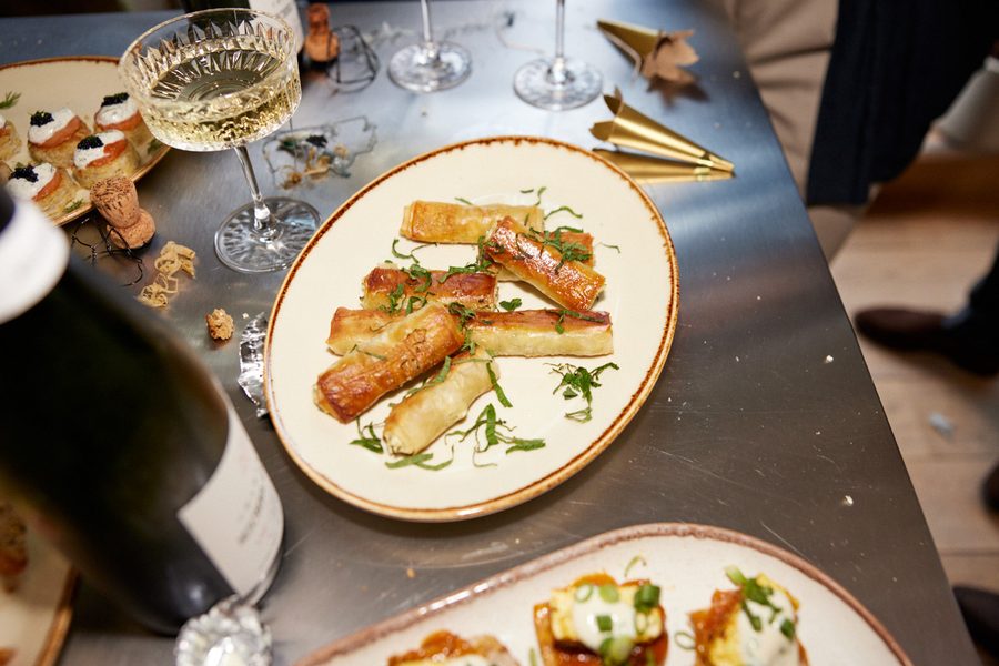 Pastry canapes with champagne and caviar at a festive event